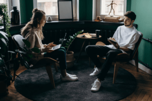 A couple discussing finances in a modern living room