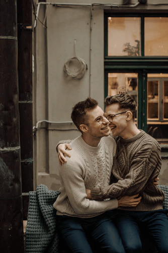 A same-sex couple embracing