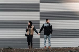 a man and a woman looking away from each other