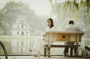woman turning away from her spouse because of disinterest