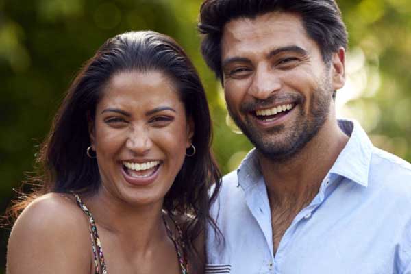 Smiling couple enjoying a healthy relationship after couples therapy in Silicon Valley