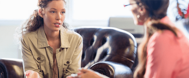 Couple in a counseling session, talking with a therapist